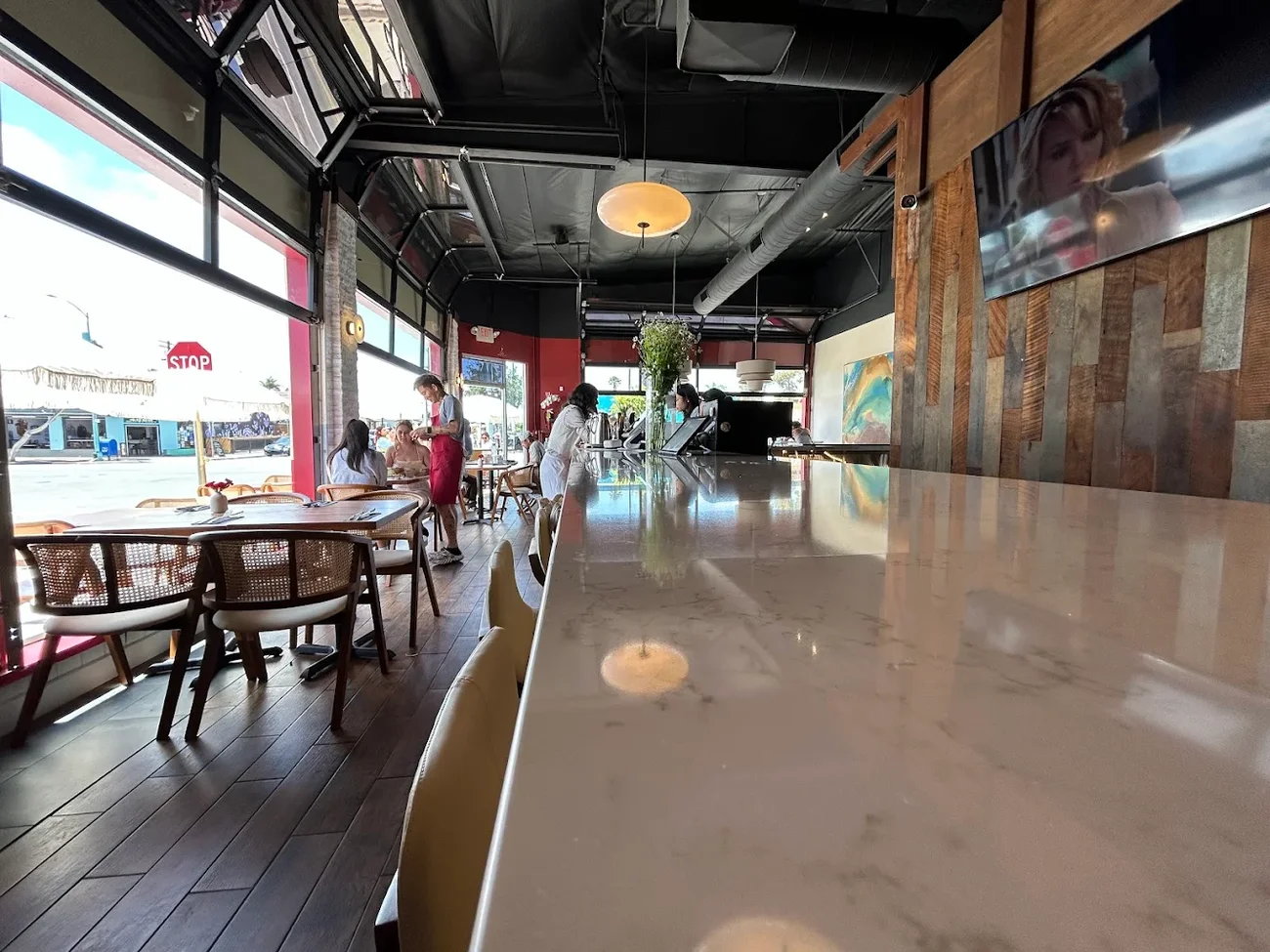 The marble bar at Between Us looking out toward 30th Street
